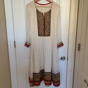 Elegant cream kurta with lace and embroidery